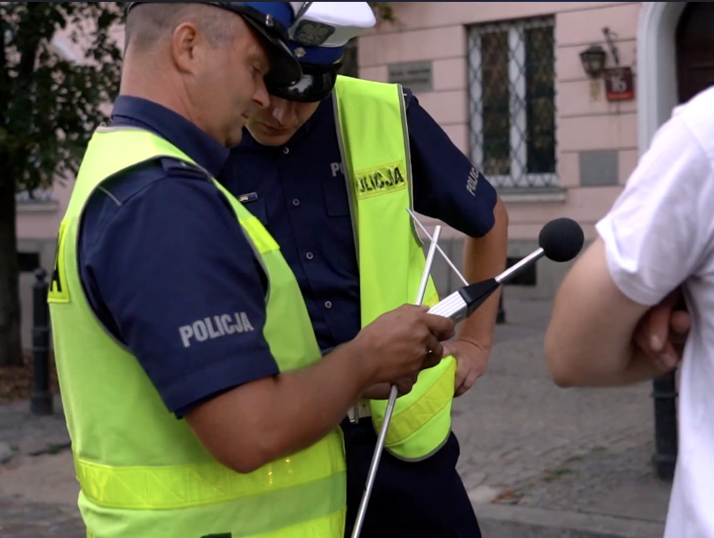 a police officers looking at a sonometr