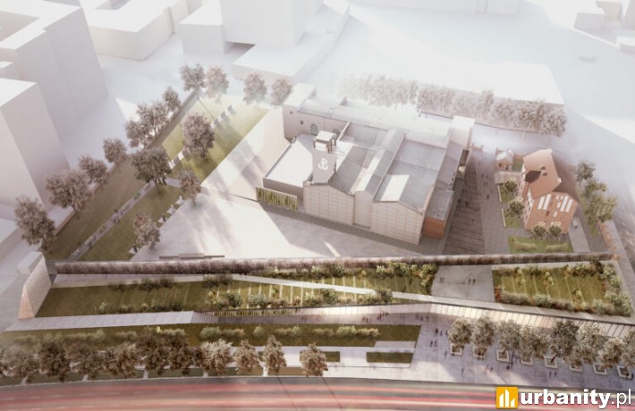 Widok z lotu ptaka na nowoczesny kompleks architektoniczny z zielonymi przestrzeniami i historycznymi budynkami.