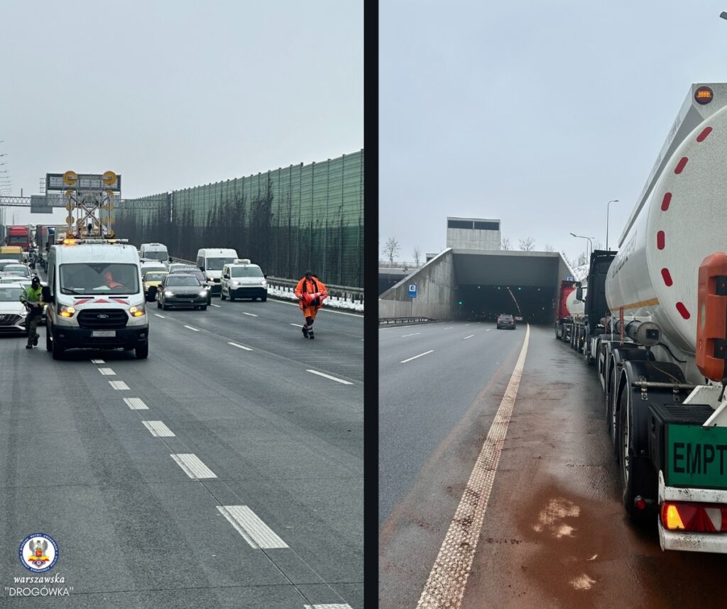 Kierowca w pomarańczowej odzieży ostrzega o utrudnieniach na ruchliwej autostradzie, obok pojazdów w korku. Po drugiej stronie, ciężarówki czekają na wjazd do tunelu, na drodze widać zielone światło.