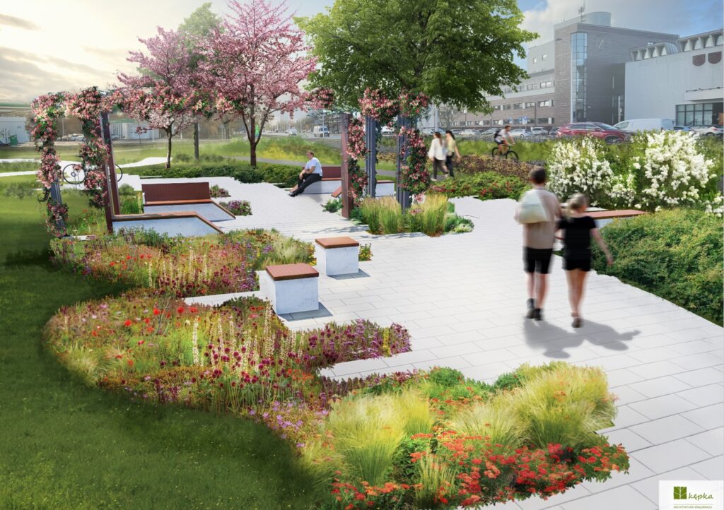 Mężczyzna siedzący na ławce w parku, w tle kwitnące drzewa i ścieżki, po których spacerują ludzie.