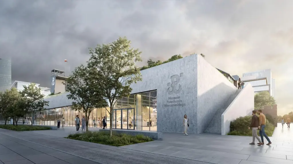 Nowoczesny budynek Muzeum Powstania Warszawskiego z przeszkloną fasadą, otoczony zielenią, z przechodzącymi ludźmi.